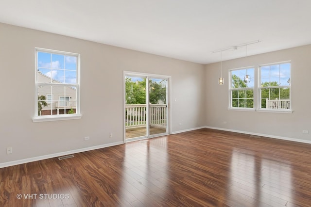 66 N Palazzo Dr, Addison, IL 60101 - unfurnished room with plenty of natural light, wood finished floors, rail lighting, and baseboards
