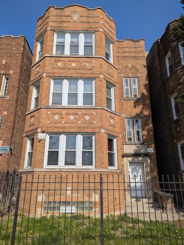 7545 S May St, Chicago, IL 60620 - view of building exterior featuring a fenced front yard