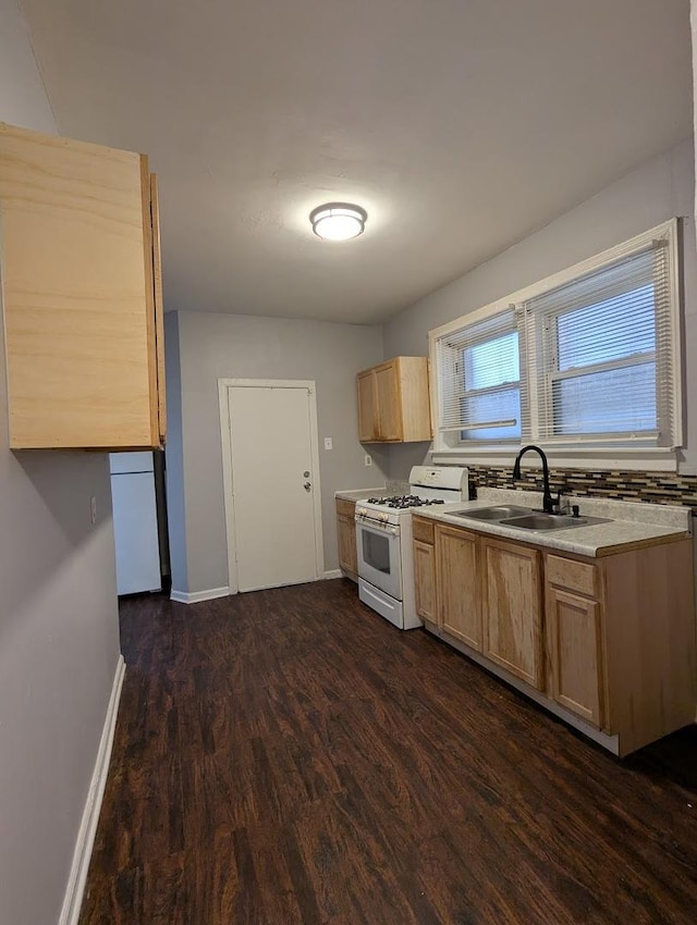 7545 S May St, Chicago, IL 60620 - kitchen featuring gas range gas stove, light brown cabinets, refrigerator, a sink, and dark wood finished floors