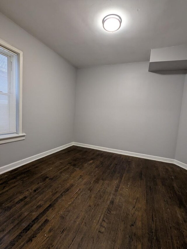 7545 S May St, Chicago, IL 60620 - unfurnished room featuring dark wood-style floors and baseboards