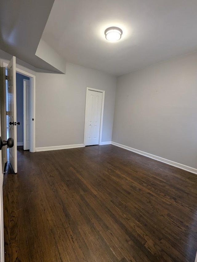 7545 S May St, Chicago, IL 60620 - empty room featuring baseboards and dark wood-style floors