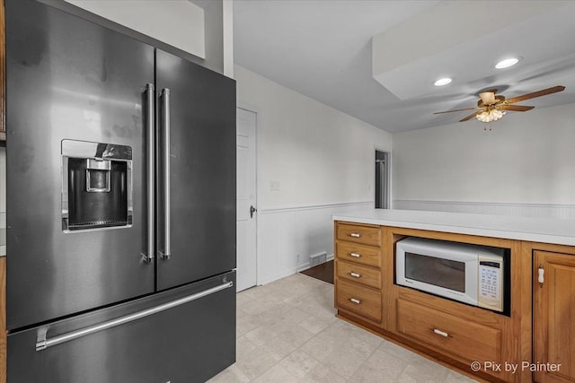 1315 W Galena Blvd, Aurora, IL 60506 - kitchen featuring high end fridge, white microwave, brown cabinetry, light countertops, and ceiling fan