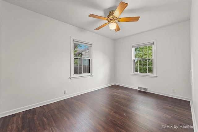 1315 W Galena Blvd, Aurora, IL 60506 - empty room featuring dark wood-type flooring, baseboards, and a ceiling fan