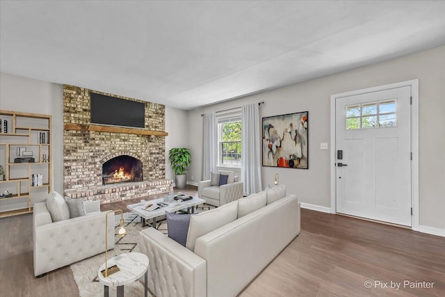 1315 W Galena Blvd, Aurora, IL 60506 - living area with wood finished floors, a brick fireplace, and baseboards