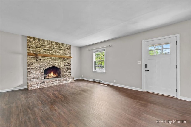 1315 W Galena Blvd, Aurora, IL 60506 - unfurnished living room featuring wood finished floors, a fireplace, and baseboards