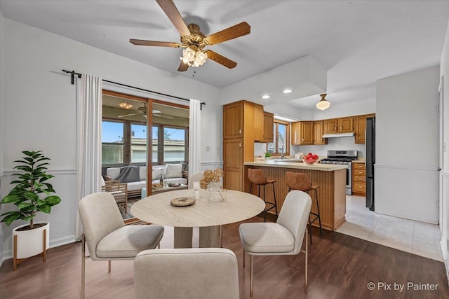 1315 W Galena Blvd, Aurora, IL 60506 - dining area with ceiling fan, a water view, light wood-type flooring, recessed lighting, and baseboards