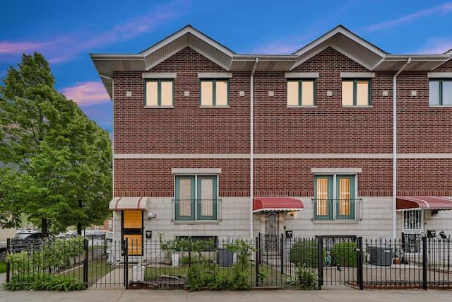 1925 W 34th St Unit A, Chicago, IL 60608 - view of front facade featuring brick siding and a fenced front yard