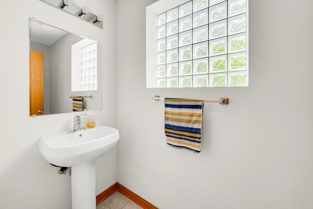 1925 W 34th St Unit A, Chicago, IL 60608 - bathroom with healthy amount of natural light, baseboards, tile patterned floors, and a sink
