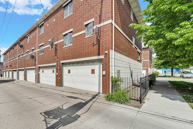 1925 W 34th St Unit A, Chicago, IL 60608 - view of side of property with brick siding and fence