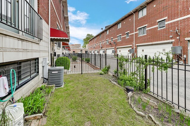 1925 W 34th St Unit A, Chicago, IL 60608 - view of yard with cooling unit and a garage