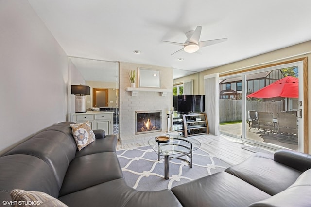 2950 Becket Ave, Westchester, IL 60154 - living area featuring light wood-type flooring, ceiling fan, and a fireplace