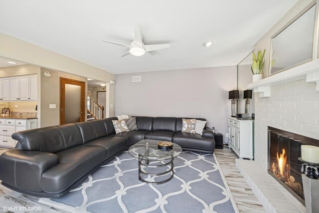 2950 Becket Ave, Westchester, IL 60154 - living area featuring ceiling fan, a brick fireplace, and light wood-style flooring