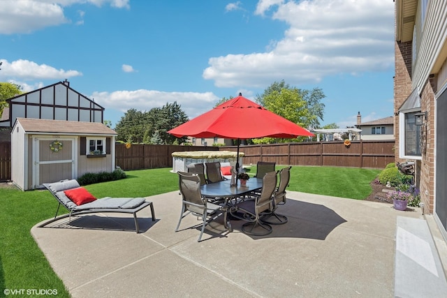 2950 Becket Ave, Westchester, IL 60154 - view of patio with a storage unit, outdoor dining area, and an outbuilding