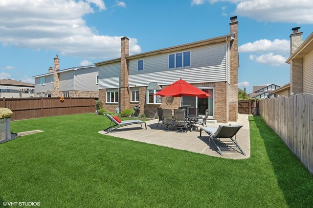 2950 Becket Ave, Westchester, IL 60154 - back of house with brick siding and a patio area
