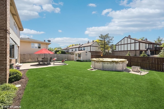 2950 Becket Ave, Westchester, IL 60154 - view of yard with a shed, a patio, and an outbuilding
