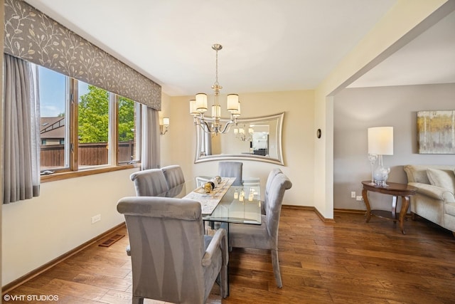 2950 Becket Ave, Westchester, IL 60154 - dining area with a chandelier, hardwood / wood-style flooring, and baseboards