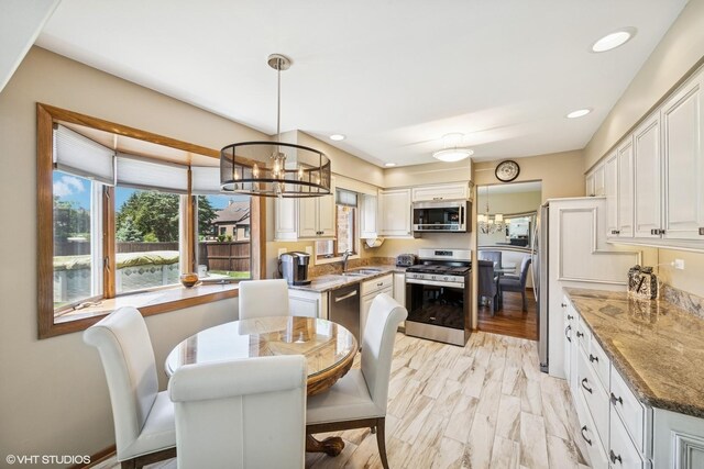 2950 Becket Ave, Westchester, IL 60154 - dining room with a chandelier and recessed lighting