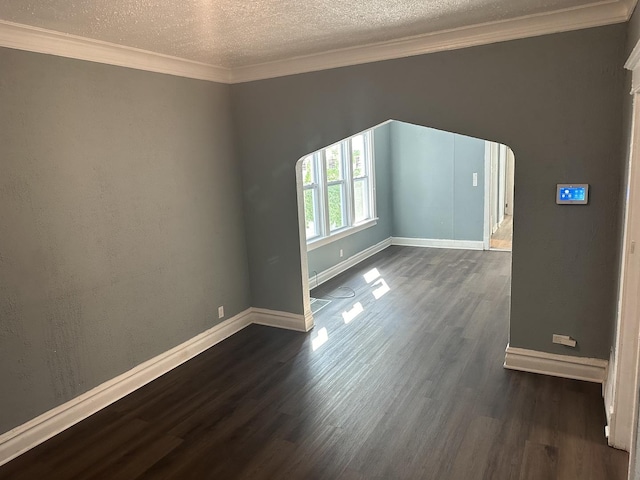 12010 S Michigan Ave, Chicago, IL 60628 - empty room with dark wood-type flooring, baseboards, a textured ceiling, arched walkways, and crown molding
