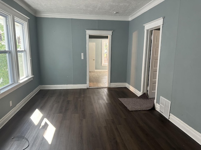 12010 S Michigan Ave, Chicago, IL 60628 - empty room featuring dark wood finished floors, a textured ceiling, ornamental molding, and baseboards