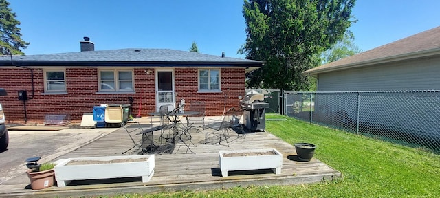 704 S Neltnor Blvd, West Chicago, IL 60185 - rear view of house with a chimney, a deck, and brick siding
