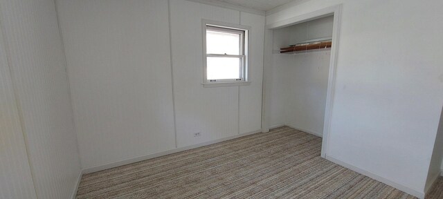 704 S Neltnor Blvd, West Chicago, IL 60185 - spare room featuring light carpet and baseboards