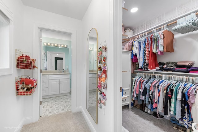 18089 W Pond Ridge Cir, Gurnee, IL 60031 - walk in closet with light carpet and a sink