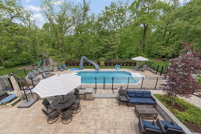 18089 W Pond Ridge Cir, Gurnee, IL 60031 - view of swimming pool with a water slide, a patio, and a playground