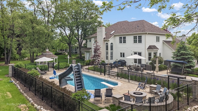 18089 W Pond Ridge Cir, Gurnee, IL 60031 - view of pool with a gazebo, an outdoor fire pit, a patio area, a water slide, and a diving board