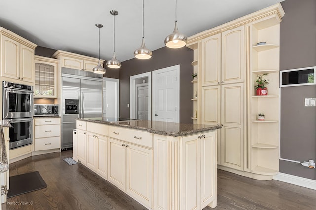 18089 W Pond Ridge Cir, Gurnee, IL 60031 - kitchen featuring open shelves, cream cabinetry, stainless steel appliances, and dark wood finished floors