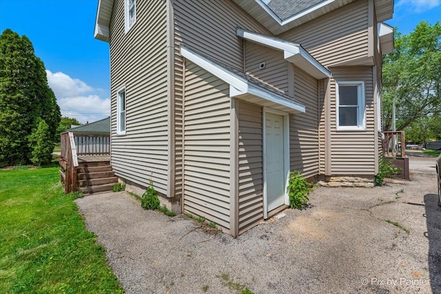 910 Market St, Dekalb, IL 60115 - view of property exterior with a lawn and a wooden deck