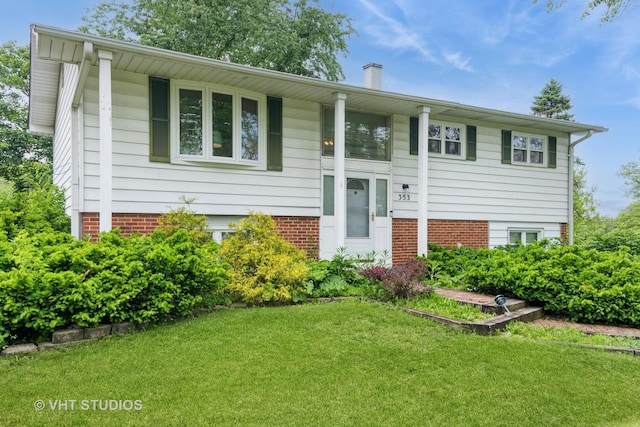 21W353 Drury Ln, Lombard, IL 60148 - raised ranch with a front lawn, a chimney, and brick siding