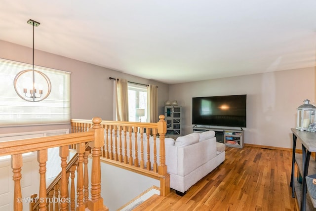 21W353 Drury Ln, Lombard, IL 60148 - living area with wood finished floors, a chandelier, and baseboards