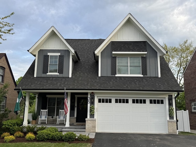 35 E Woodworth Pl, Roselle, IL 60172 - craftsman inspired home with board and batten siding, a porch, roof with shingles, and asphalt driveway