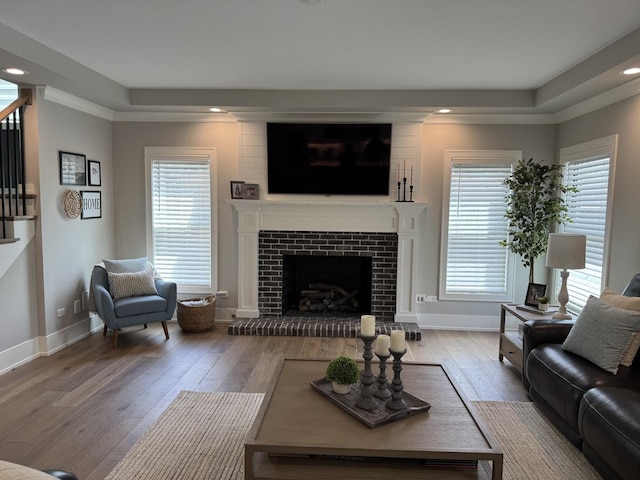 35 E Woodworth Pl, Roselle, IL 60172 - living area with hardwood / wood-style flooring, stairway, a fireplace with raised hearth, recessed lighting, and baseboards