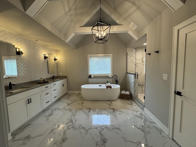 35 E Woodworth Pl, Roselle, IL 60172 - full bath featuring baseboards, double vanity, a marble finish shower, a freestanding tub, and a chandelier