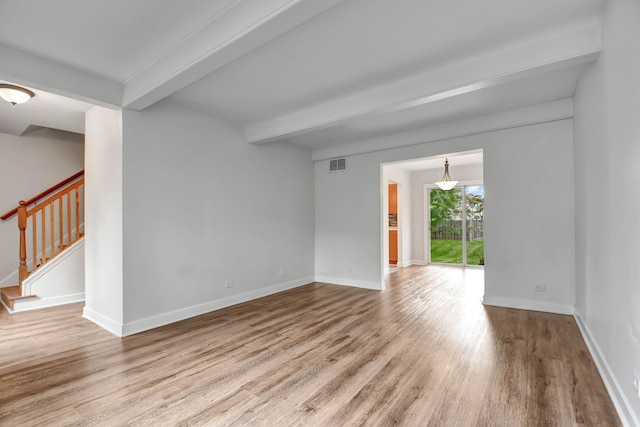300 Redwing Dr, Bolingbrook, IL 60440 - empty room featuring beam ceiling, wood finished floors, stairway, and baseboards