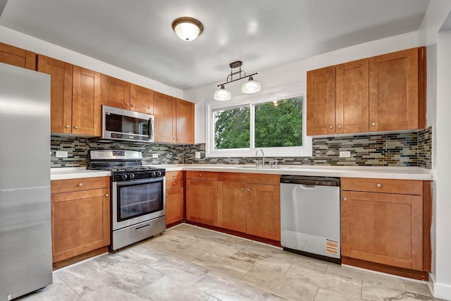 300 Redwing Dr, Bolingbrook, IL 60440 - kitchen with stainless steel appliances, backsplash, light countertops, and brown cabinets