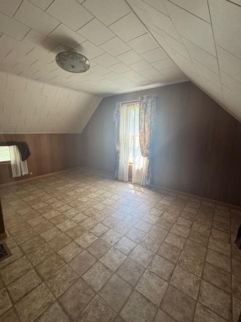 303 W Prairie St, Pontiac, IL 61764 - additional living space with wooden walls and vaulted ceiling