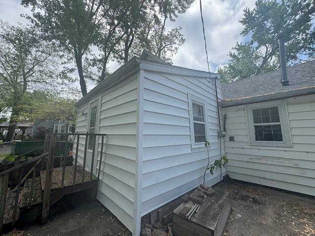 303 W Prairie St, Pontiac, IL 61764 - view of side of home featuring a deck