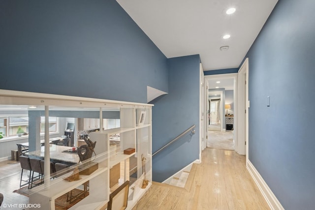 4253 Grove St, Skokie, IL 60076 - hall with wood finished floors, recessed lighting, baseboards, and an upstairs landing