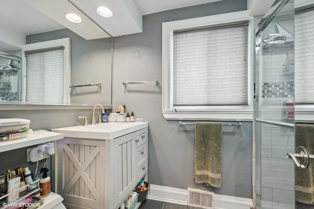 4253 Grove St, Skokie, IL 60076 - bathroom featuring vanity, an enclosed shower, and baseboards