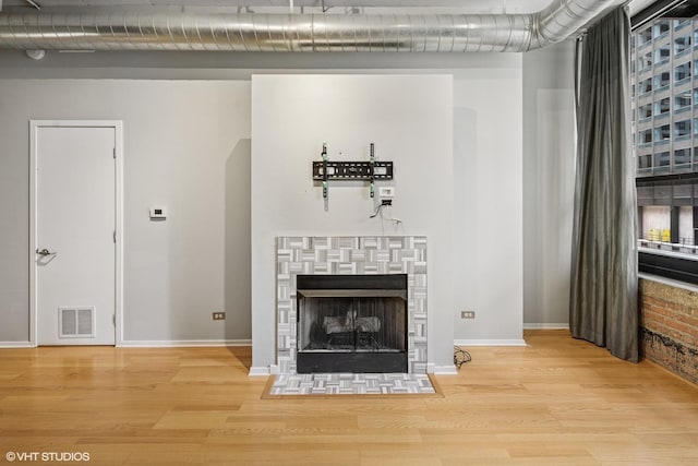 130 S Canal St Unit 216, Chicago, IL 60606 - detailed view of wood finished floors, baseboards, and a fireplace