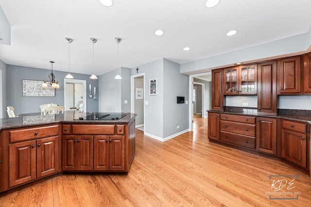1309 Brunswick Ct, Naperville, IL 60540 - kitchen featuring black electric stovetop, light wood-style floors, decorative light fixtures, glass insert cabinets, and recessed lighting