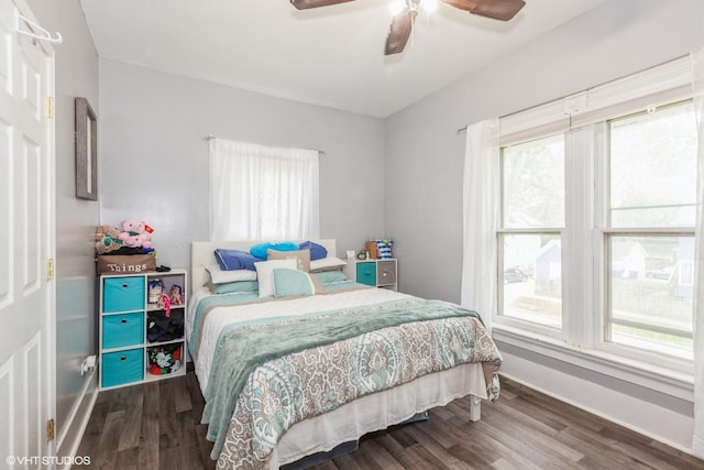523 Spruce St, Aurora, IL 60506 - bedroom with multiple windows, wood finished floors, and baseboards