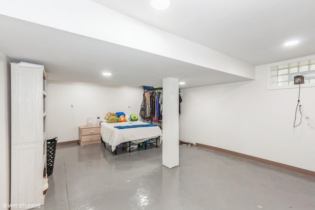 523 Spruce St, Aurora, IL 60506 - bedroom with concrete floors, baseboards, and recessed lighting