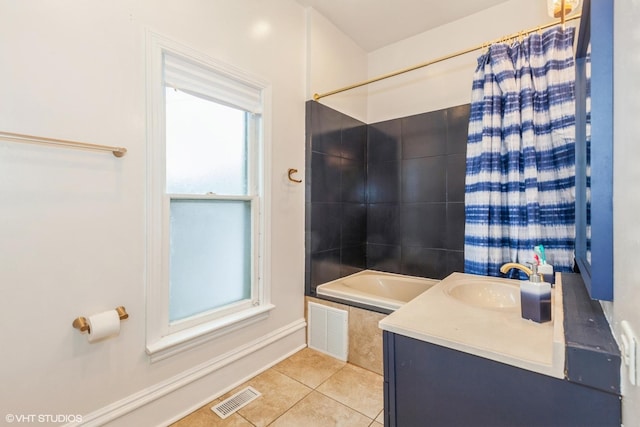 523 Spruce St, Aurora, IL 60506 - bathroom featuring tile patterned flooring, vanity, shower / tub combo with curtain, and baseboards