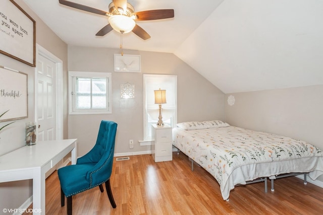 523 Spruce St, Aurora, IL 60506 - bedroom with light wood-type flooring, lofted ceiling, baseboards, and ceiling fan