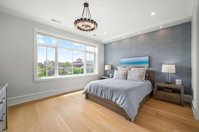 736 W Melrose St Unit 4W, Chicago, IL 60657 - bedroom with baseboards, an accent wall, light wood finished floors, recessed lighting, and a chandelier