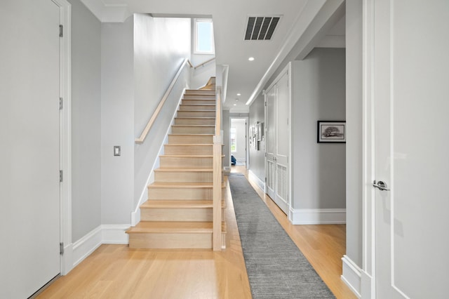 736 W Melrose St Unit 4W, Chicago, IL 60657 - stairs with wood finished floors, healthy amount of natural light, baseboards, and recessed lighting
