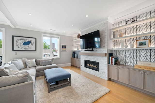 736 W Melrose St Unit 4W, Chicago, IL 60657 - living room featuring light wood-style flooring, a fireplace, crown molding, baseboards, and recessed lighting